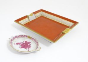 A Herend porcelain ashtray of oval form decorated in the Chinese Bouquet pattern in pink. Together
