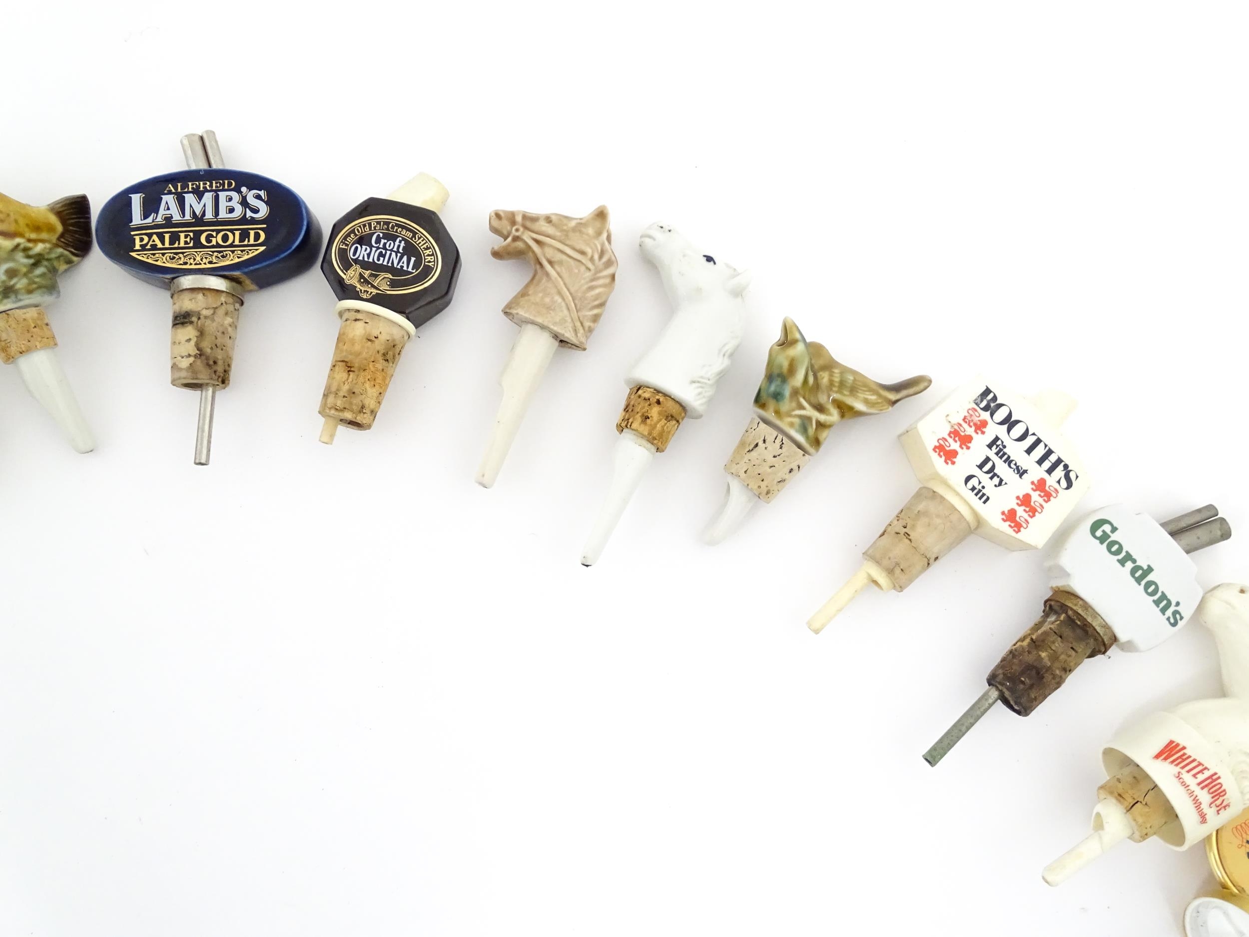 Breweriana : A quantity of assorted 20thC advertising bottle stoppers / pourers to include Booth's - Image 16 of 16