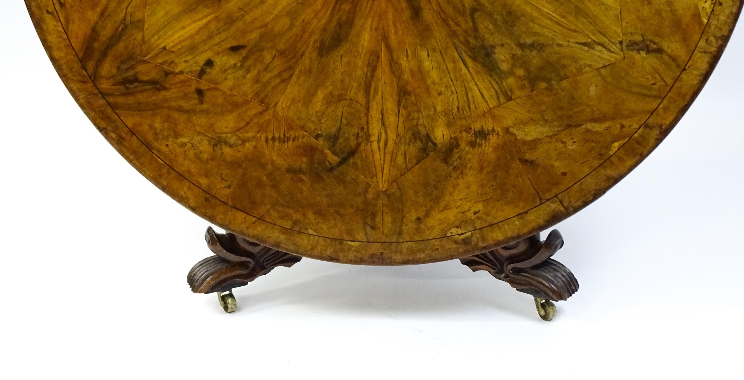 A 19thC dining table with an olive wood veneered circular top raised on a rosewood pedestal with - Image 3 of 15