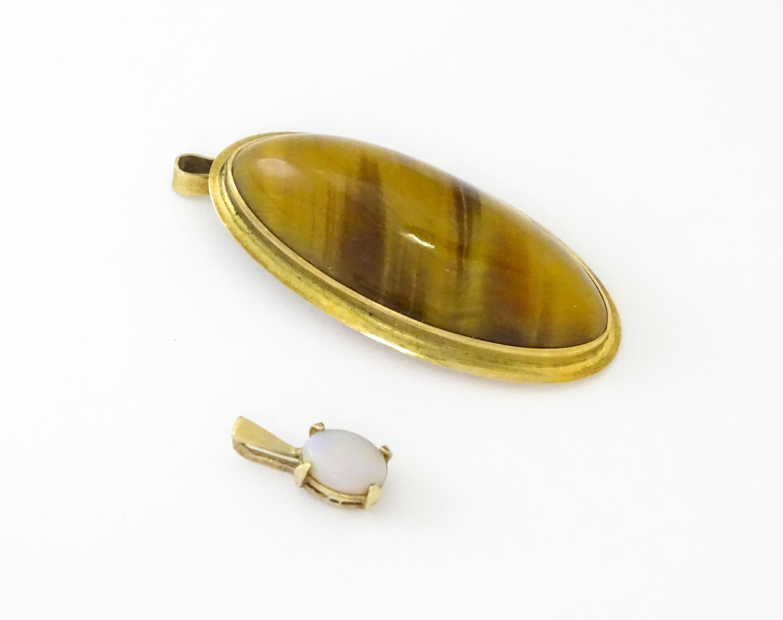 A 9ct gold pendant set with opal together with a pendant set with tigers eye cabochon. Approx 1 1/2" - Image 4 of 9