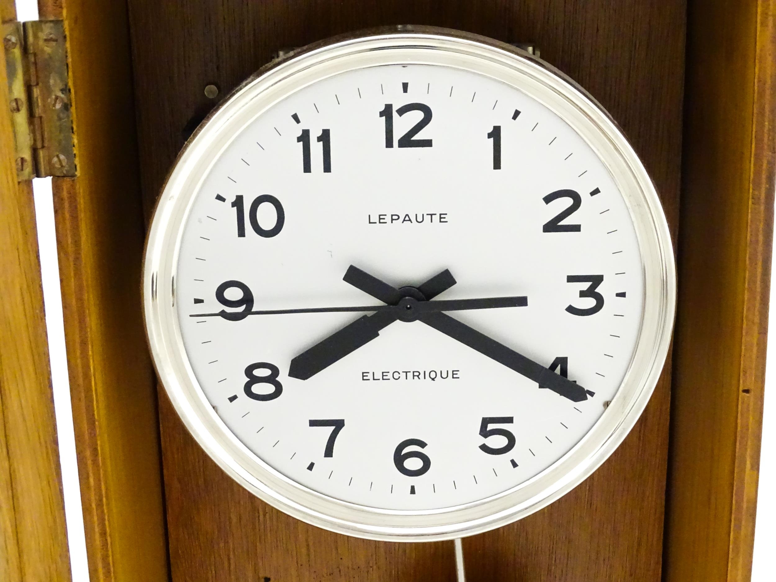 Lepaute : An early 20thC oak cased electric clock. The white dial with Arabic numerals signed - Image 6 of 6