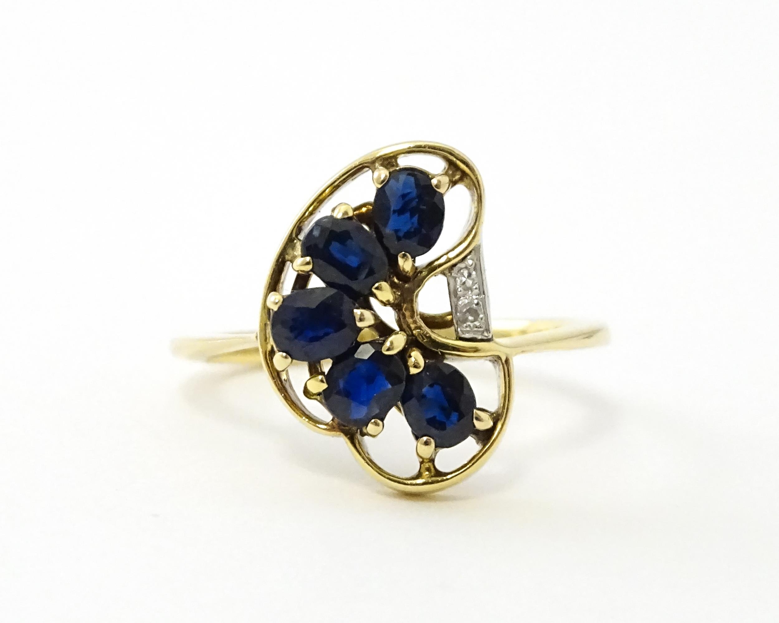 A 9ct gold ring set with 5 graduated blue spinel and two diamonds. Ring size approx. L 1/2 Please - Image 3 of 7