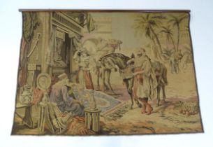 A 20thC Continental tapestry depicting a Middle Eastern market scene with figures and a street