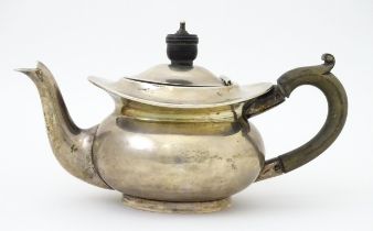 A Bachelors silver teapot hallmarked Birmingham 1904 maker Deakin & Francis. Approx 4" high Please