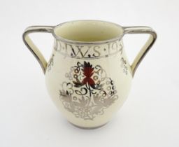 A Wedgwood twin handled bicentenary vase designed by Louis Powell commemorating the birth of