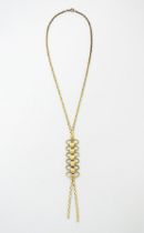 A 9ct gold necklace with textured oval detail to lower section. Bearing import marks for London