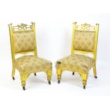 A pair of early 20thC giltwood nursing chairs with Anglo-Japanese pierced design elements and raised