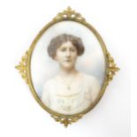 A 19thC watercolour portrait miniature depicting a young lady wearing a white dress with floral