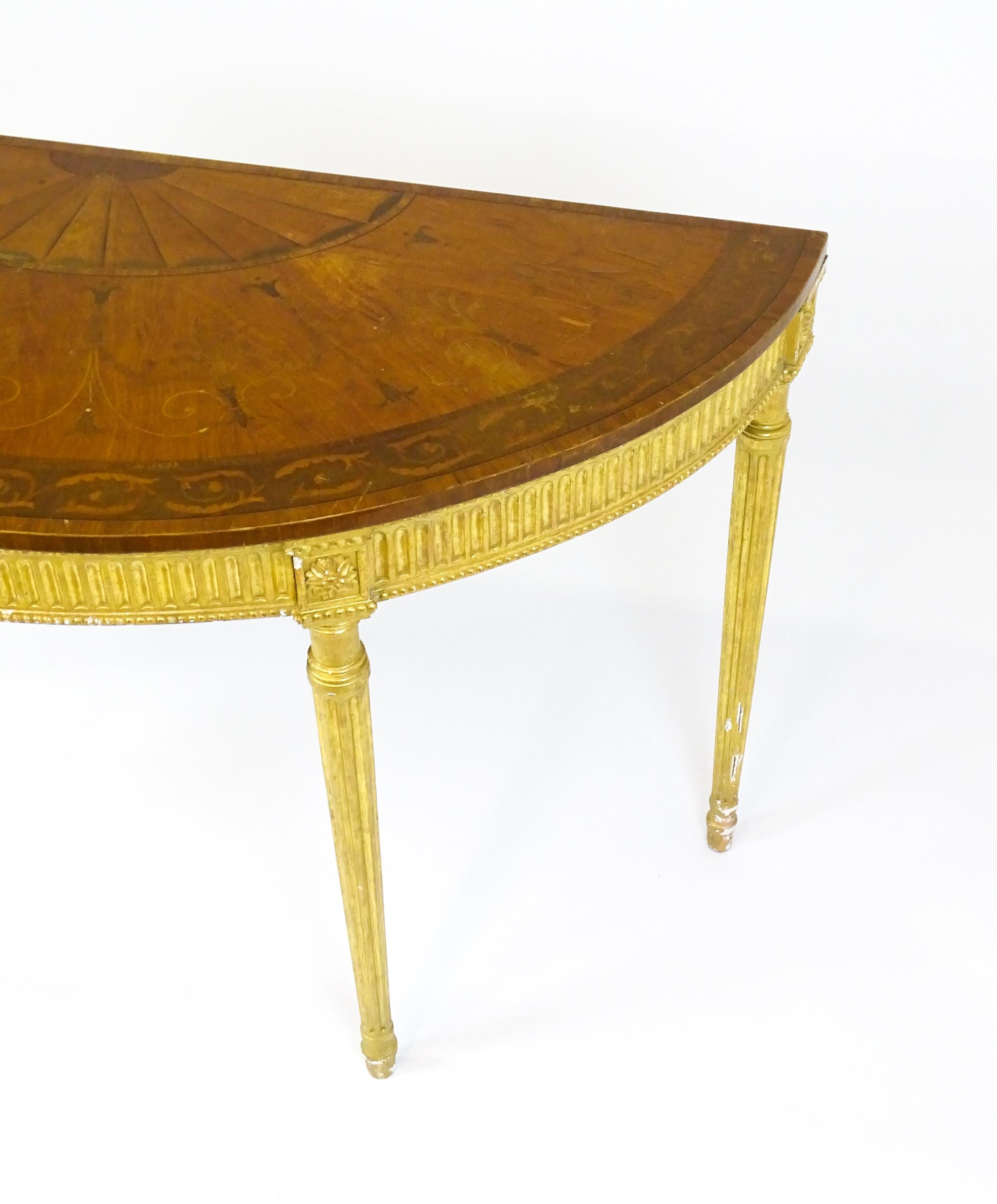 A demi lune console table with a marquetry inlaid top above a fluted frieze and moulded floral - Image 8 of 11