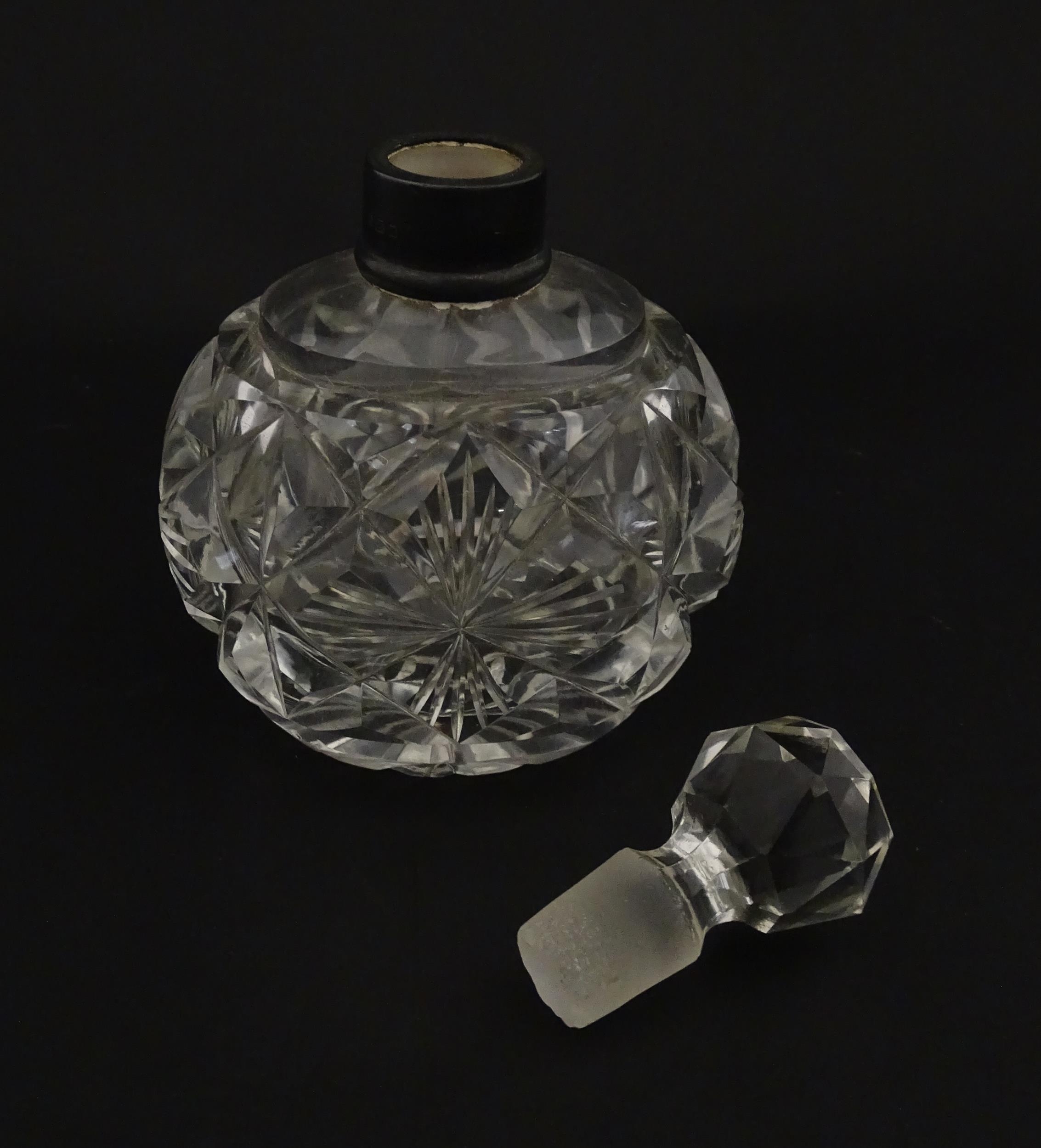 A cut glass scent / perfume bottle with silver top hallmarked London C.1933 . Approx. 5 1/4" high - Image 3 of 8