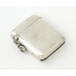 A silver vesta case hallmarked Birmingham1922 , maker A & J Zimmerman Ltd. Approx.1 3/4" long Please