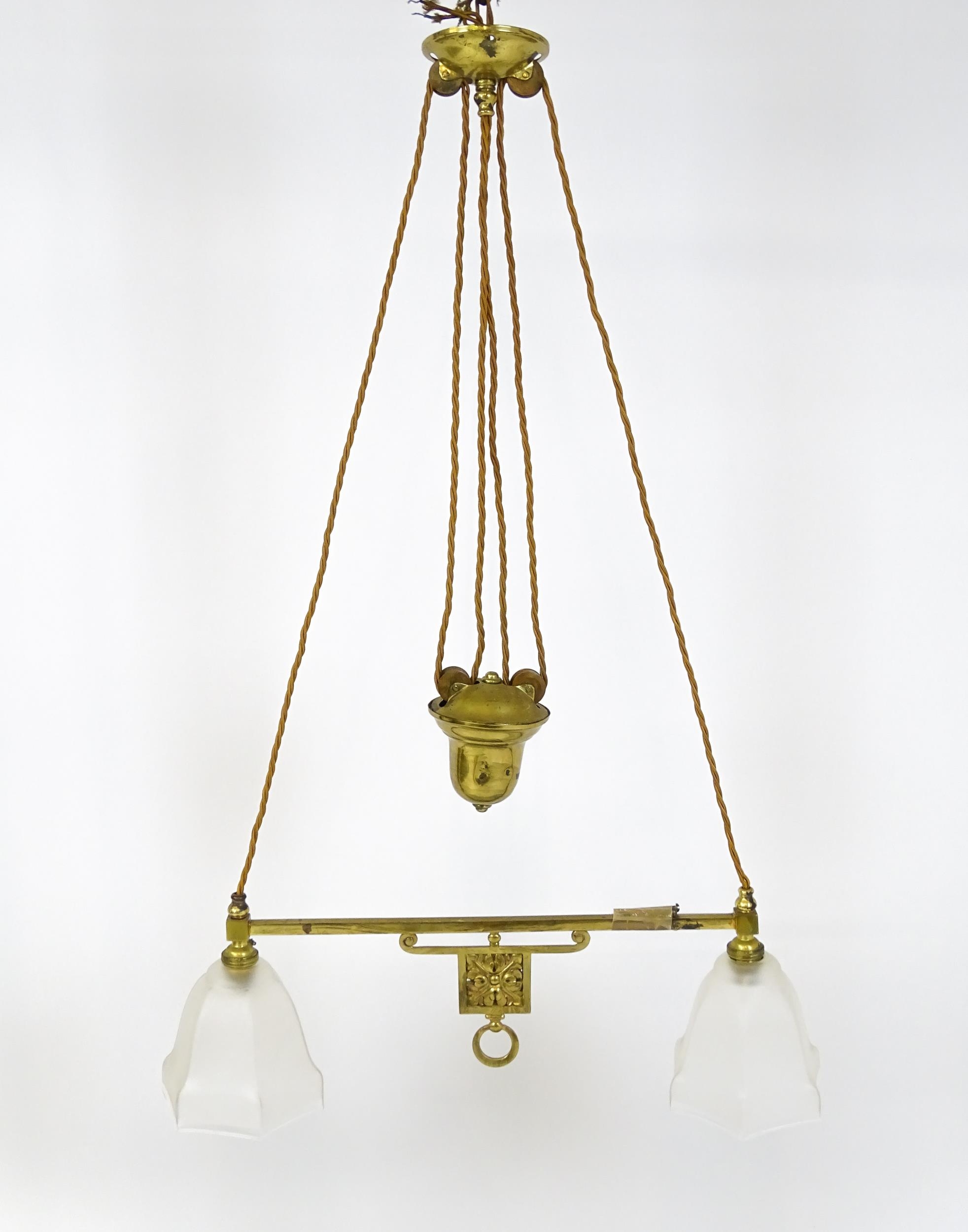 An early 20thC rise and fall adjustable height pendant light with with brass detail and twin frosted - Image 2 of 10