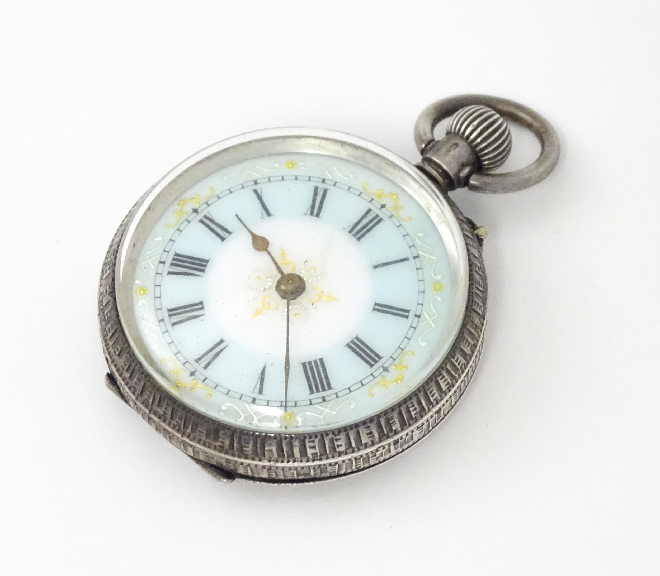 A Swiss silver cased pocket / fob watch with enamel detail and Roman Numerals. Approx 1 /4" wide - Image 5 of 11