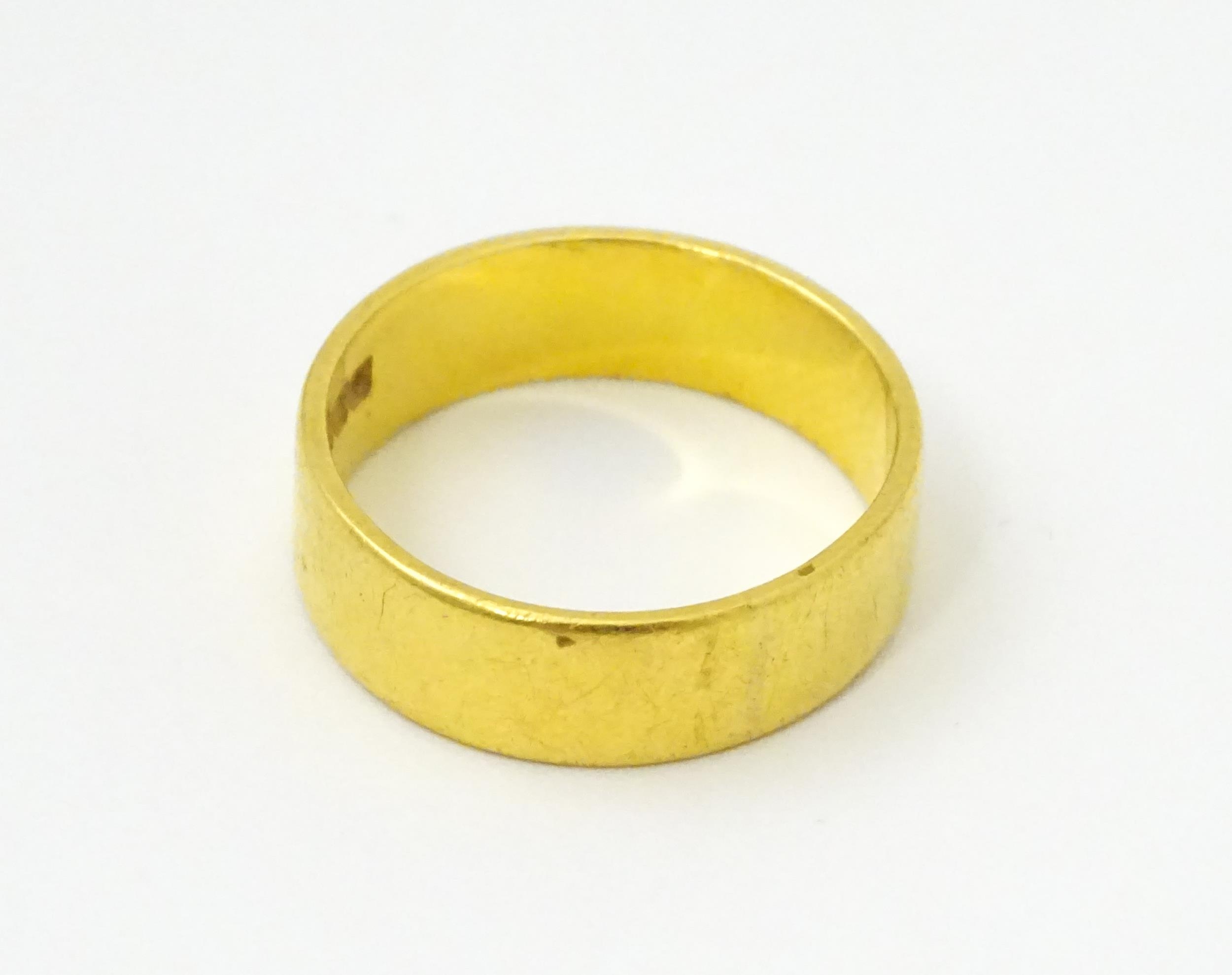 A 22ct gold ring / wedding band. Ring size approx. M 1/2 Please Note - we do not make reference to - Image 2 of 6