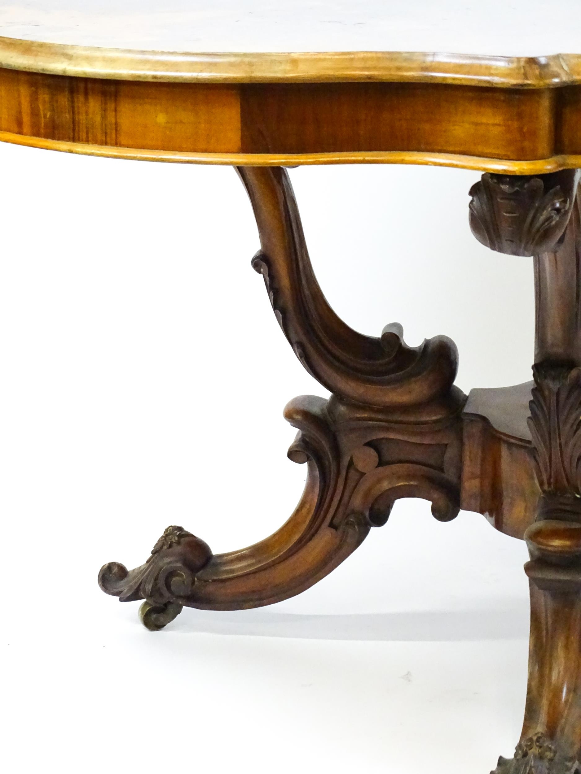 A 19thC burr walnut centre table with a moulded top above four acanthus carved supports, a large - Image 5 of 16