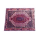 Carpet / Rug: A North West Persian Senneh rug, the red, blue and cream grounds decorated with