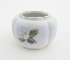 A Royal Copenhagen pot of shaped form with flower detail. Marked under. Approx. 3" high Please