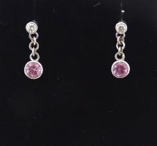 A pair of white gold drop earrings set with diamonds with pink sapphire drops. Approx. 1/2" long