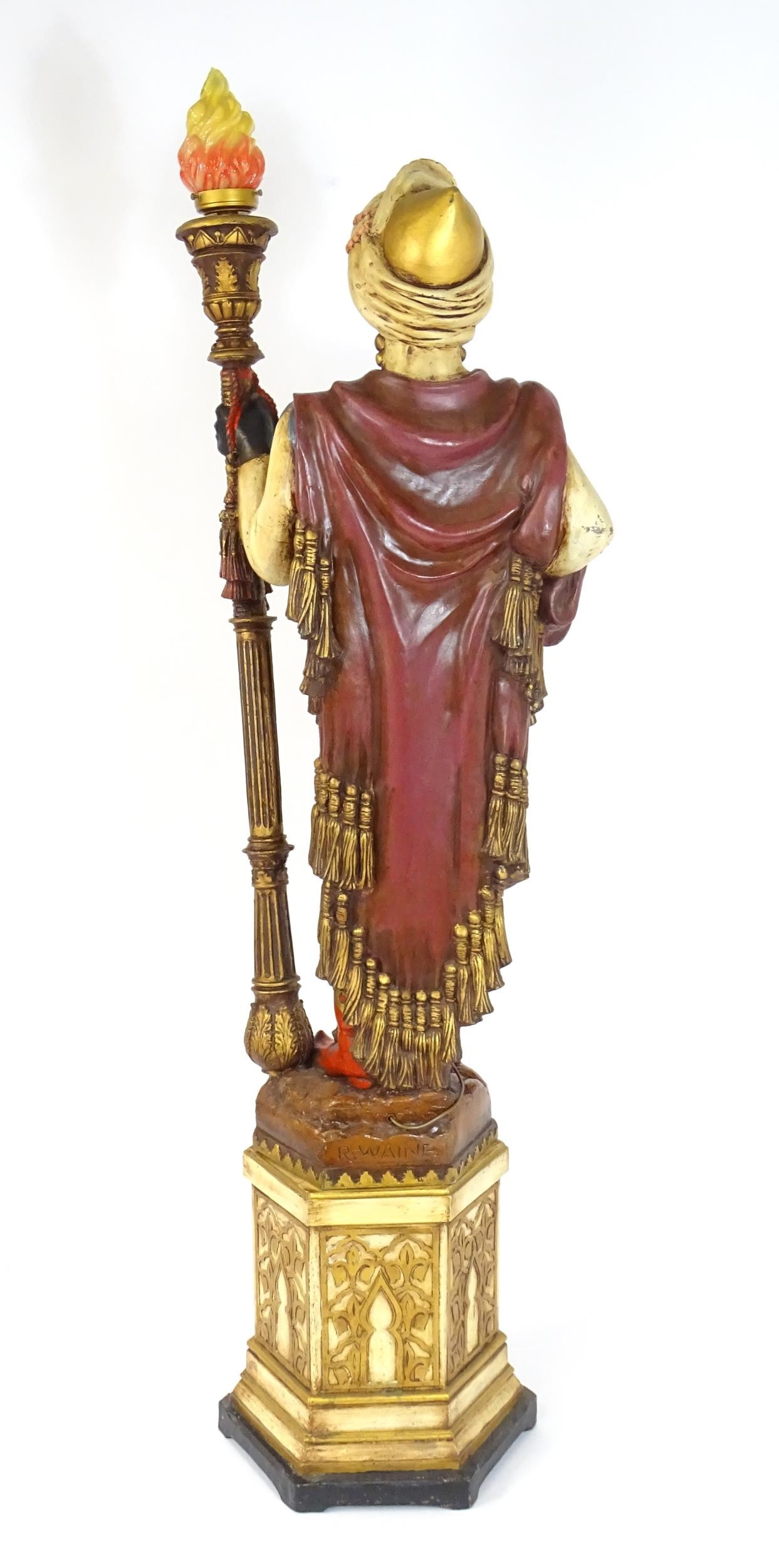 A mid 20thC blackamoor lamp, the lamp having a polychrome figural top grasping a torchiere, the - Image 12 of 14