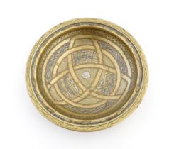 A Middle Eastern brass dish / bowl with incised detail and inlaid white metal and copper