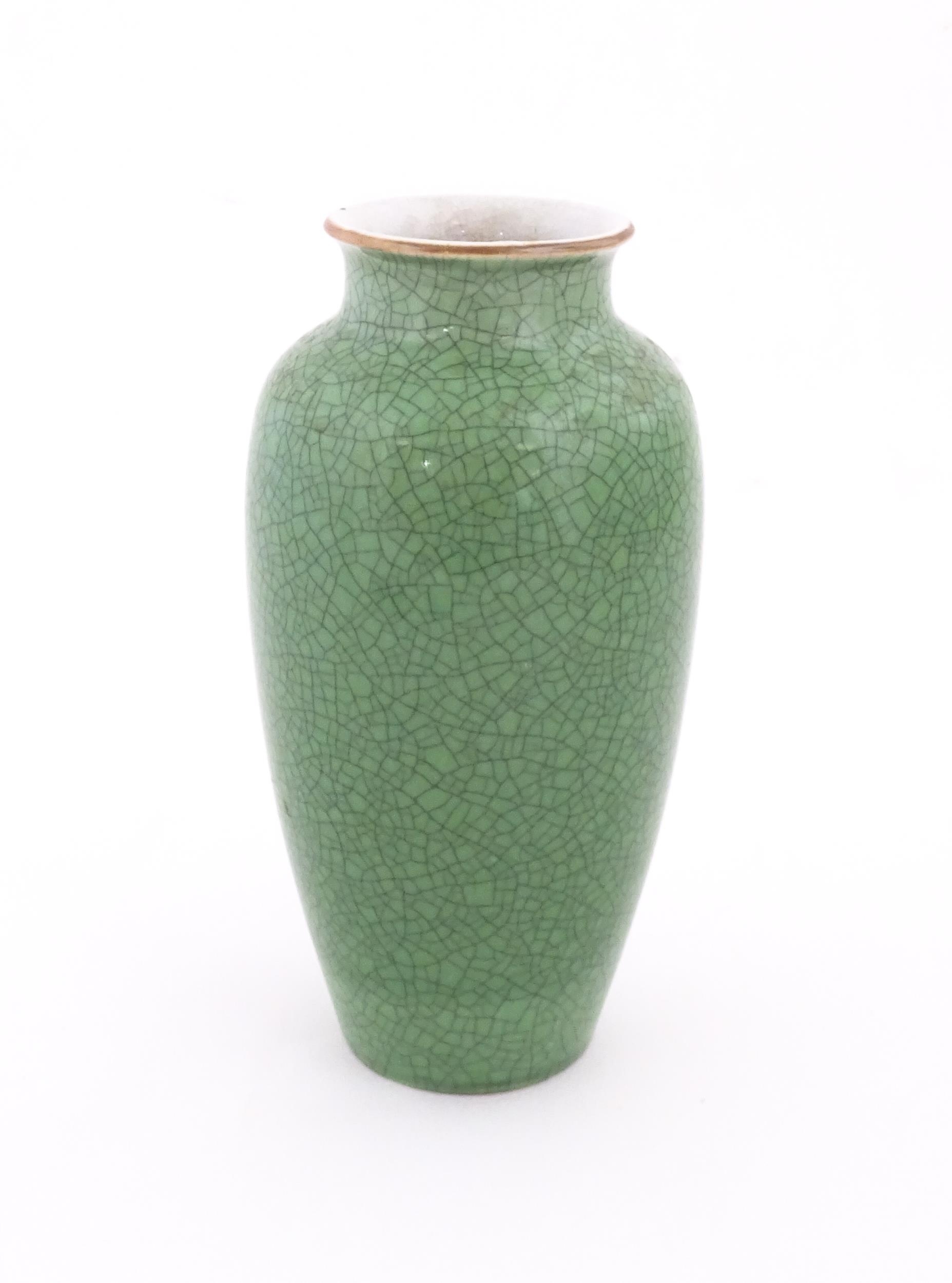 A Chinese vase with a green crackle glaze. Approx. 10 1/4" high Please Note - we do not make