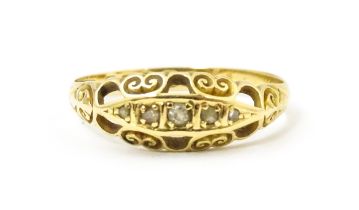 An 18ct gold ring set with five diamonds. Ring size approx. O Please Note - we do not make reference