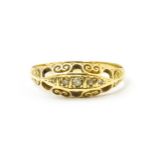 An 18ct gold ring set with five diamonds. Ring size approx. O Please Note - we do not make reference