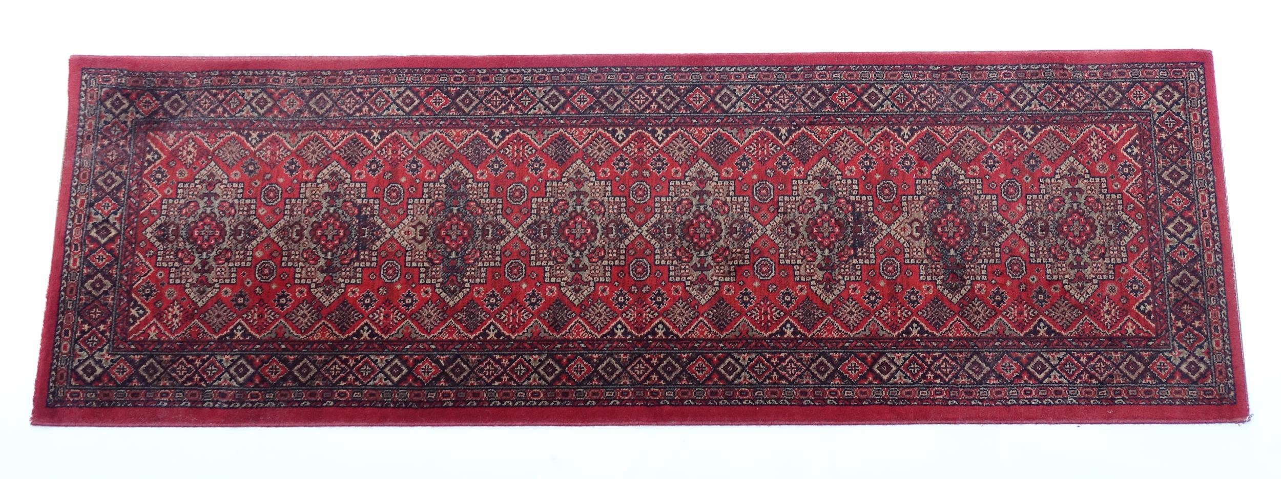 Carpet / Rug : A red ground runner with repeating motifs to centre, bordered by geometric banding. - Image 3 of 8