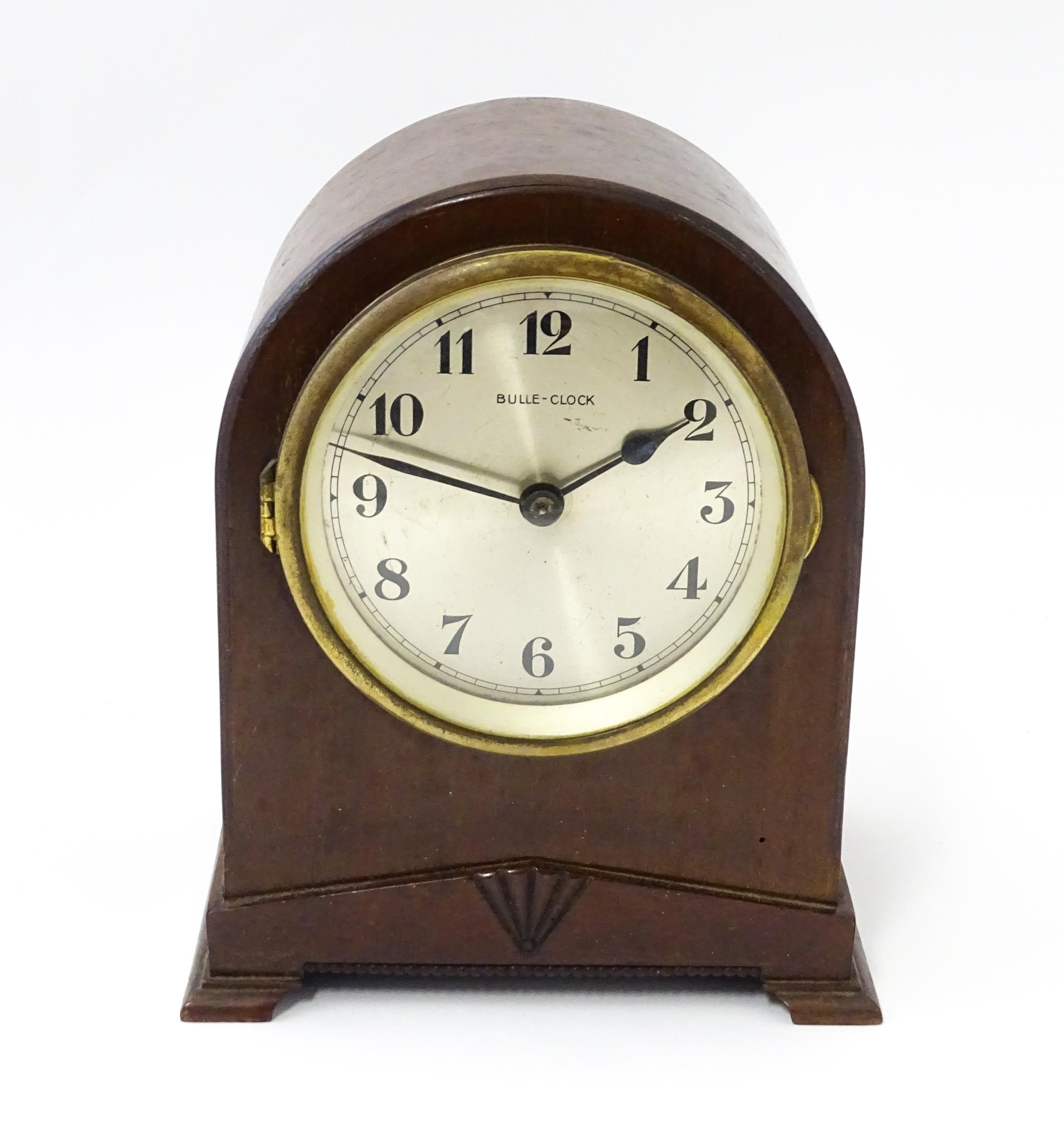 Bulle - Clock : A French Art Deco mahogany cased electric mantel clock by Bulle. model XC. Approx. 8