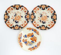 A Derby plate decorated in the Imari palette with flowers and foliage. Together with two similar