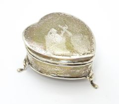 A silver ring box of heart form hallmarked Birmingham 1912, maker Synyer & Beddoes. Approx. 2 1/4"