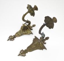 Two cast wall sconces with urn and rams head detail. Approx. 12" high (2) Please Note - we do not
