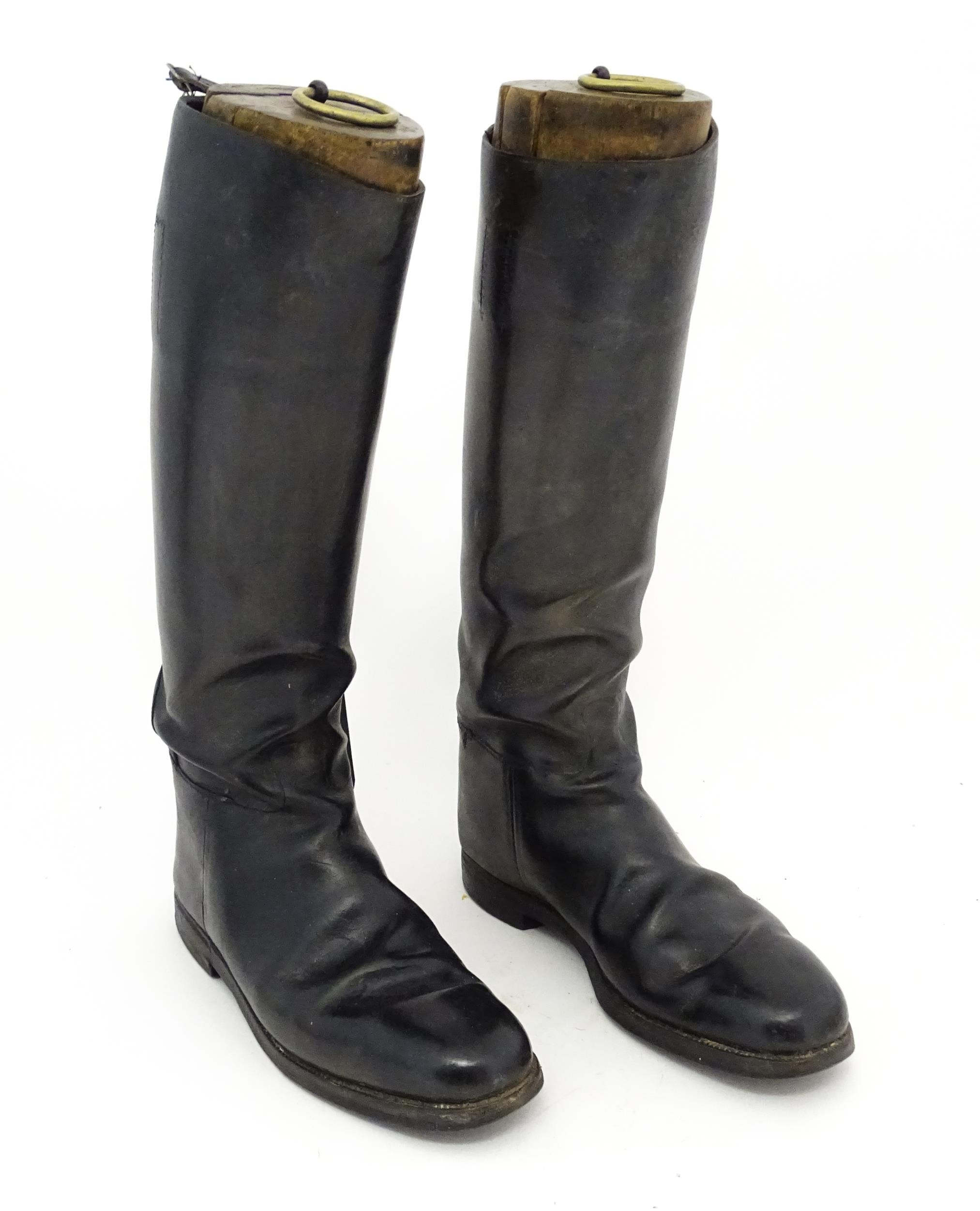 An early 20thC pair of black leather riding boots with trees, approx size 10 (2) Please Note - we do