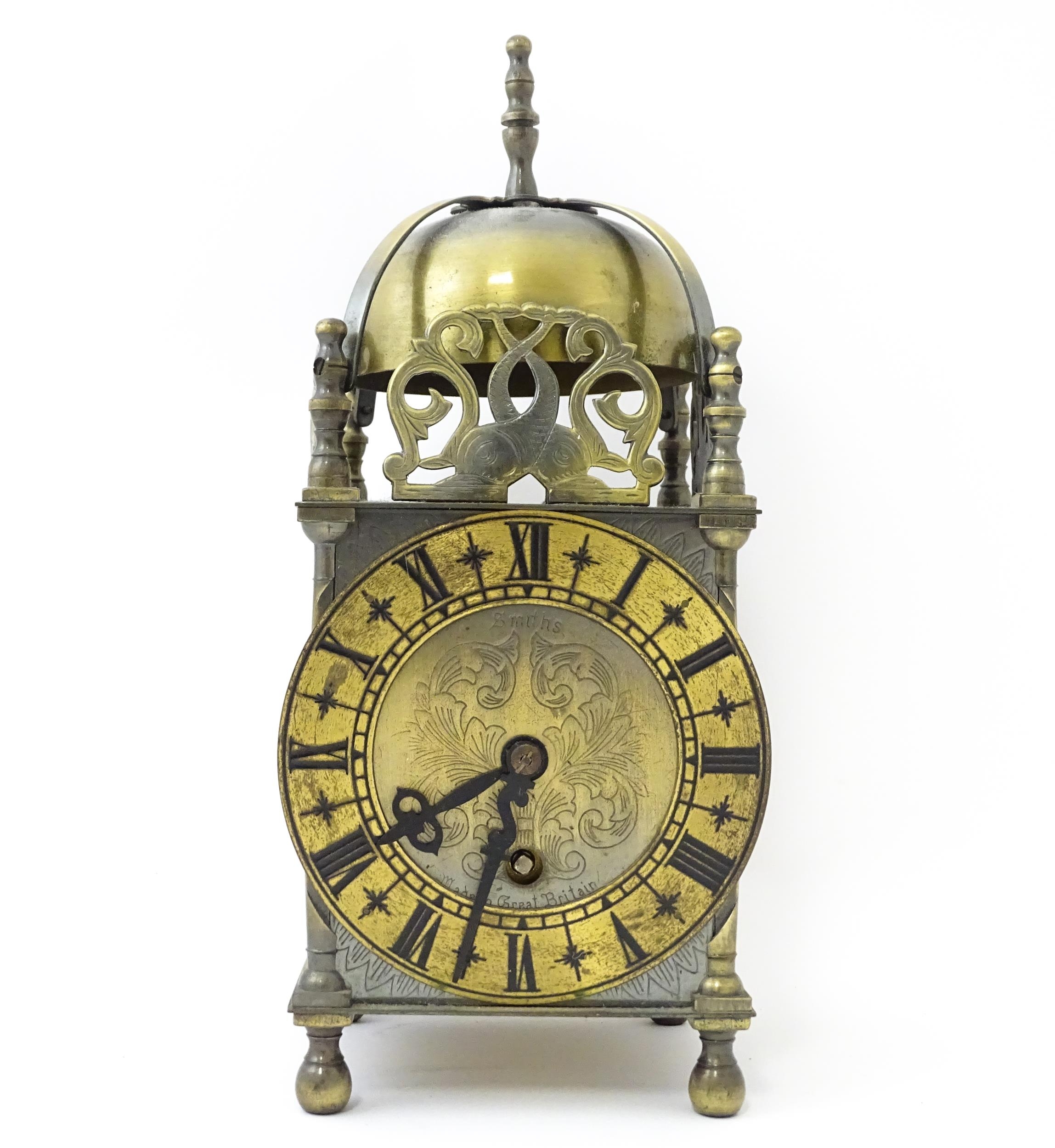 Smiths - Great Britain : A 20thC brass lantern clock by Smiths with engraved dial and Roman