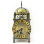 Smiths - Great Britain : A 20thC brass lantern clock by Smiths with engraved dial and Roman