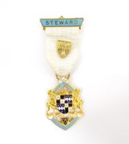 Freemasonry / Masonic Interest: A gilt metal and enamelled Masonic medal / badge titled Steward,