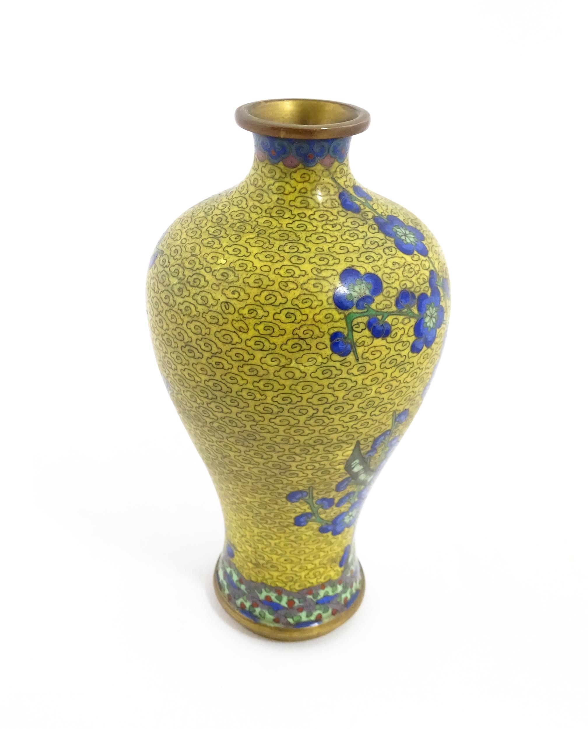 A Chinese cloisonne vase with a yellow ground decorated with blue prunus flowers / blossom. - Image 4 of 7