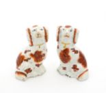 A pair of Staffordshire seated dogs with collar detail. Approx. 4" high (2) Please Note - we do