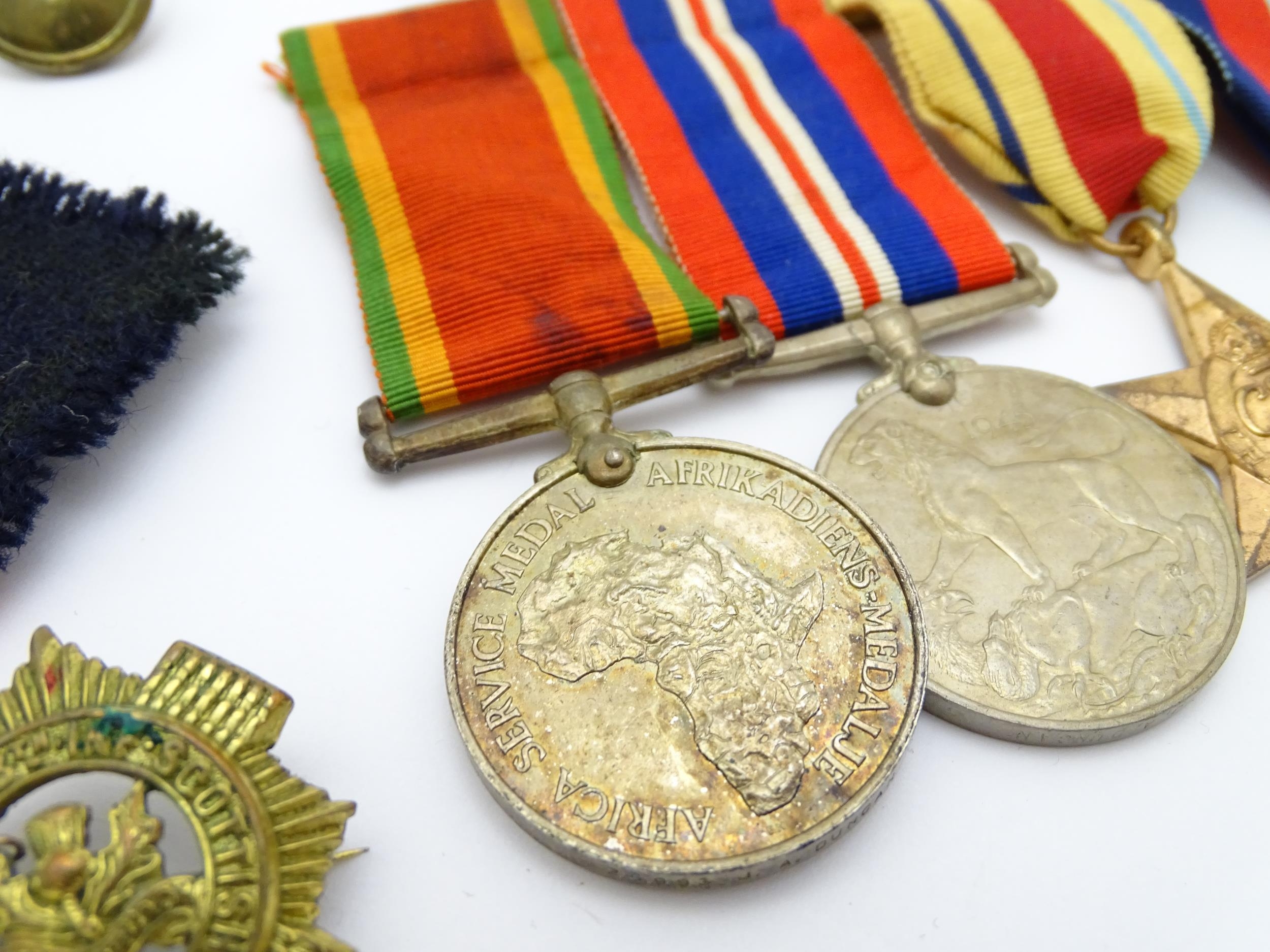 Militaria : a quantity of 20thC medals and insignia, comprising two WWI campaign medals to Gnr. W. - Image 4 of 16