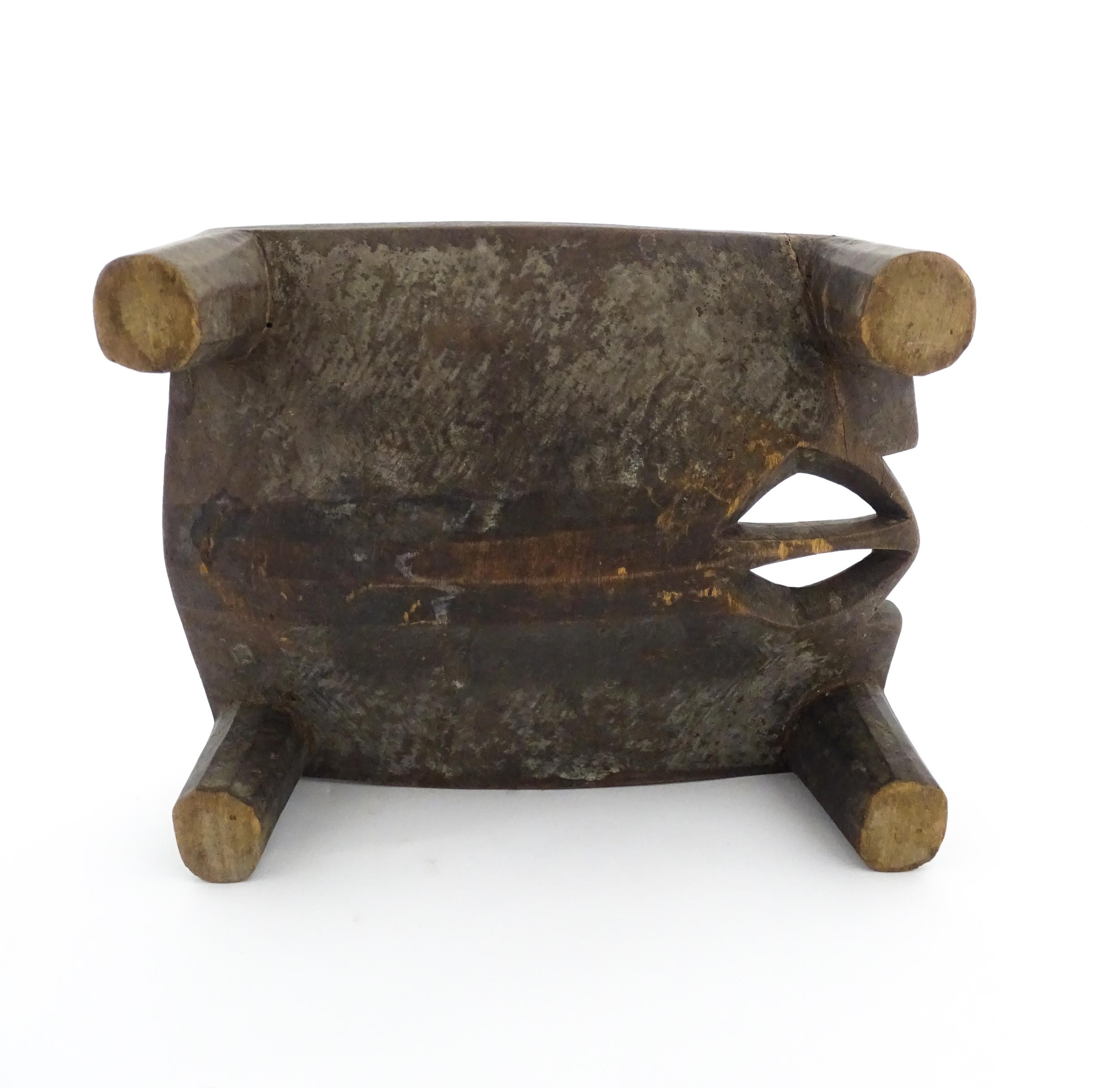 Ethnographic / Native / Tribal: An African carved wooden stool with pierced decoration, raised on - Image 7 of 7