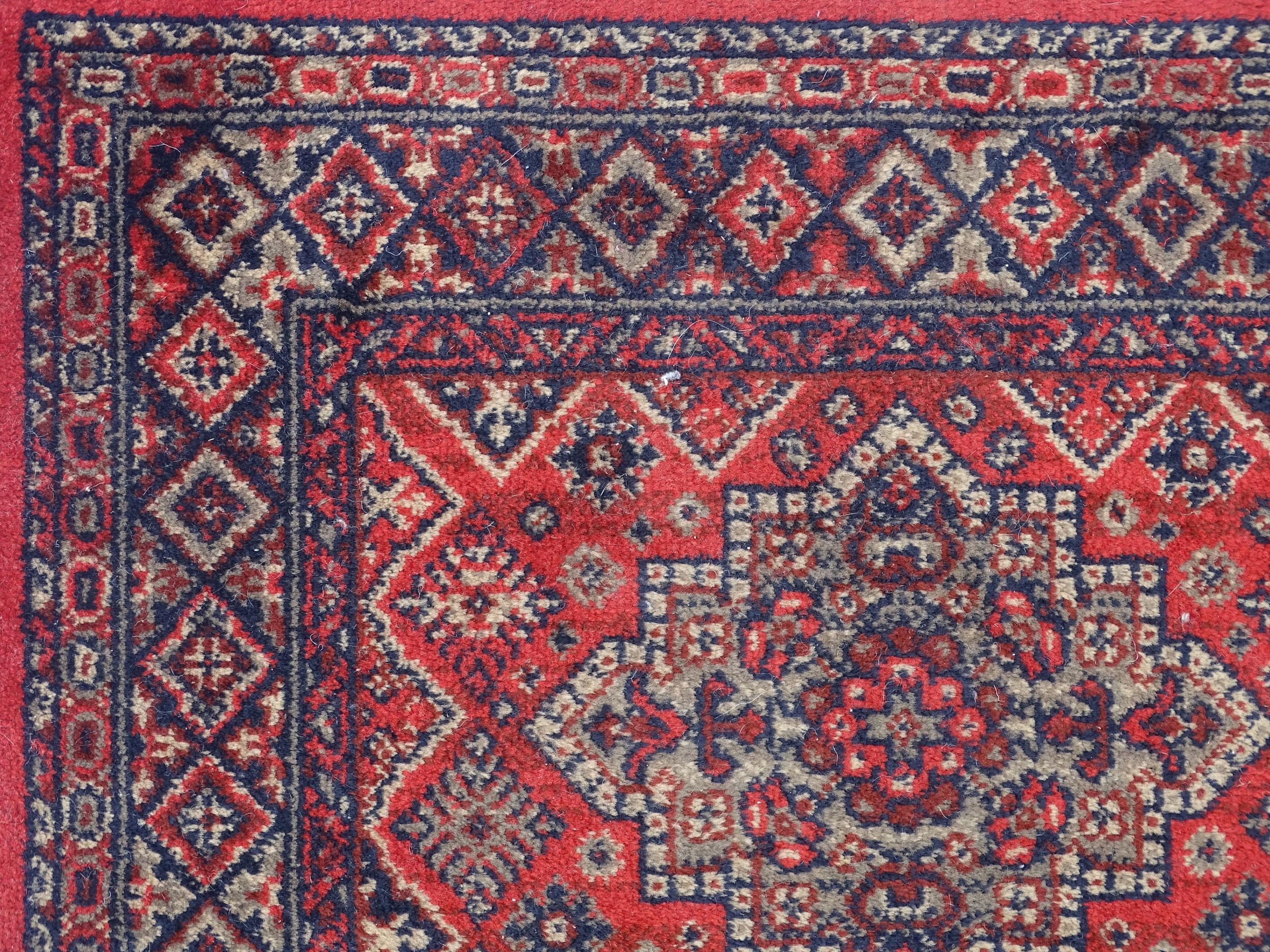 Carpet / Rug : A red ground runner with repeating motifs to centre, bordered by geometric banding. - Image 5 of 8