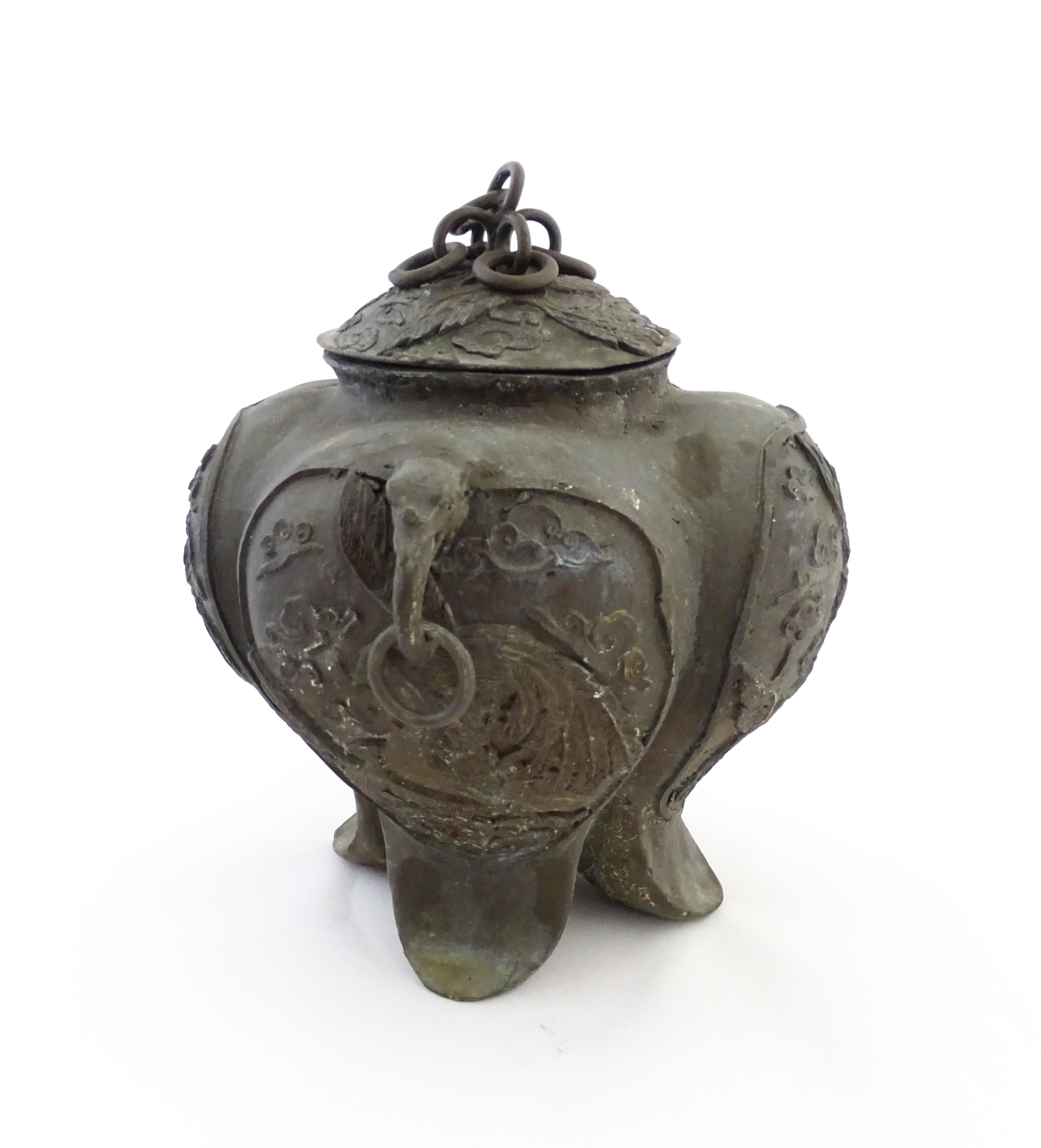 A Chinese cast vessel of lobed form with twin ring handles modelled as elephant heads, the body - Image 8 of 9
