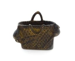An Oriental cast model of a basket with two rats. Approx. 3 1/4" wide Please Note - we do not make