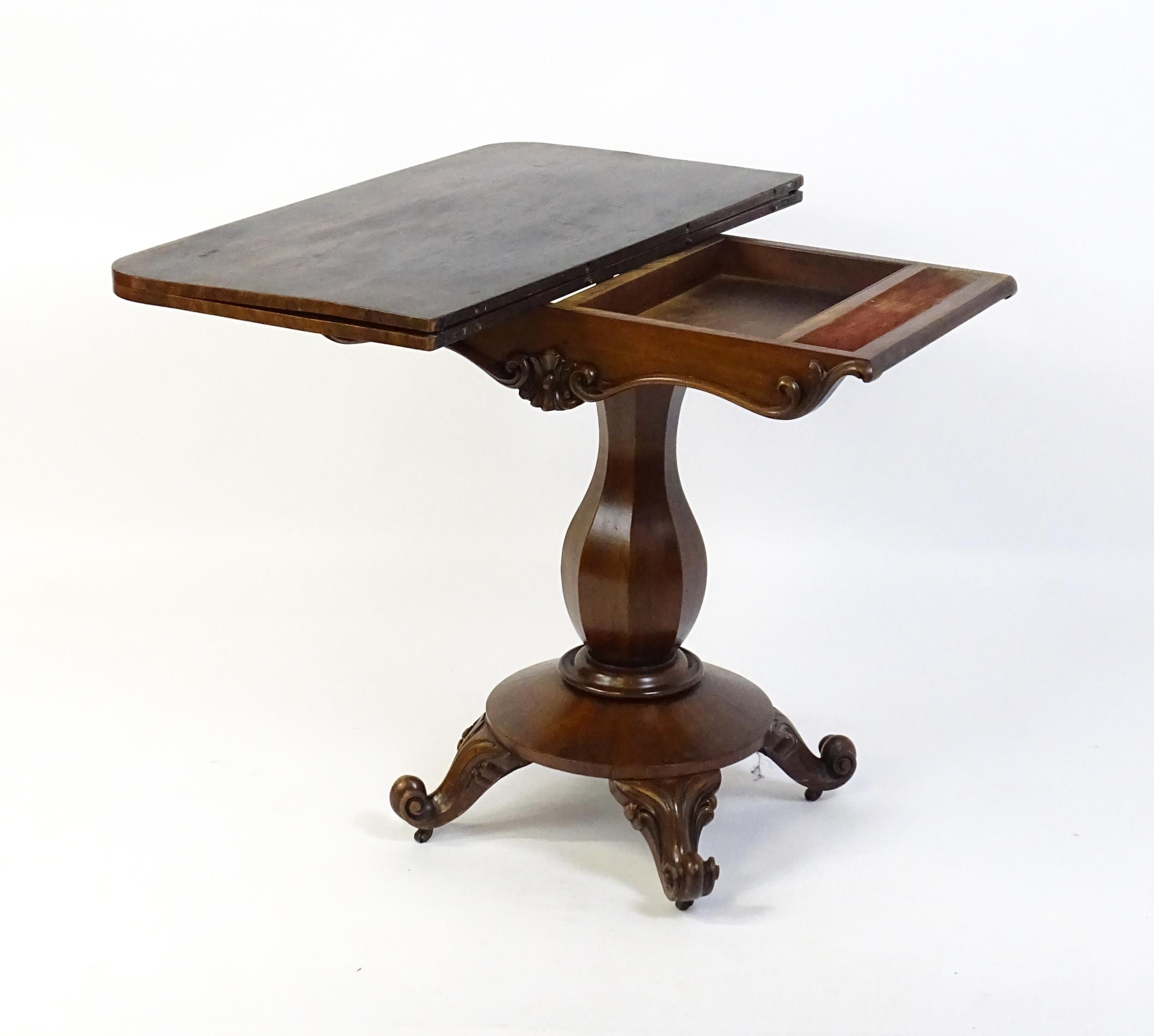 A 19thC mahogany tea table with a carved floral front panel above a canted and shaped pedestal above - Image 4 of 4