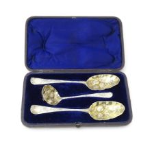 A matched late 18thC silver berry / strawberry set comprising two berry spoons and a sifting