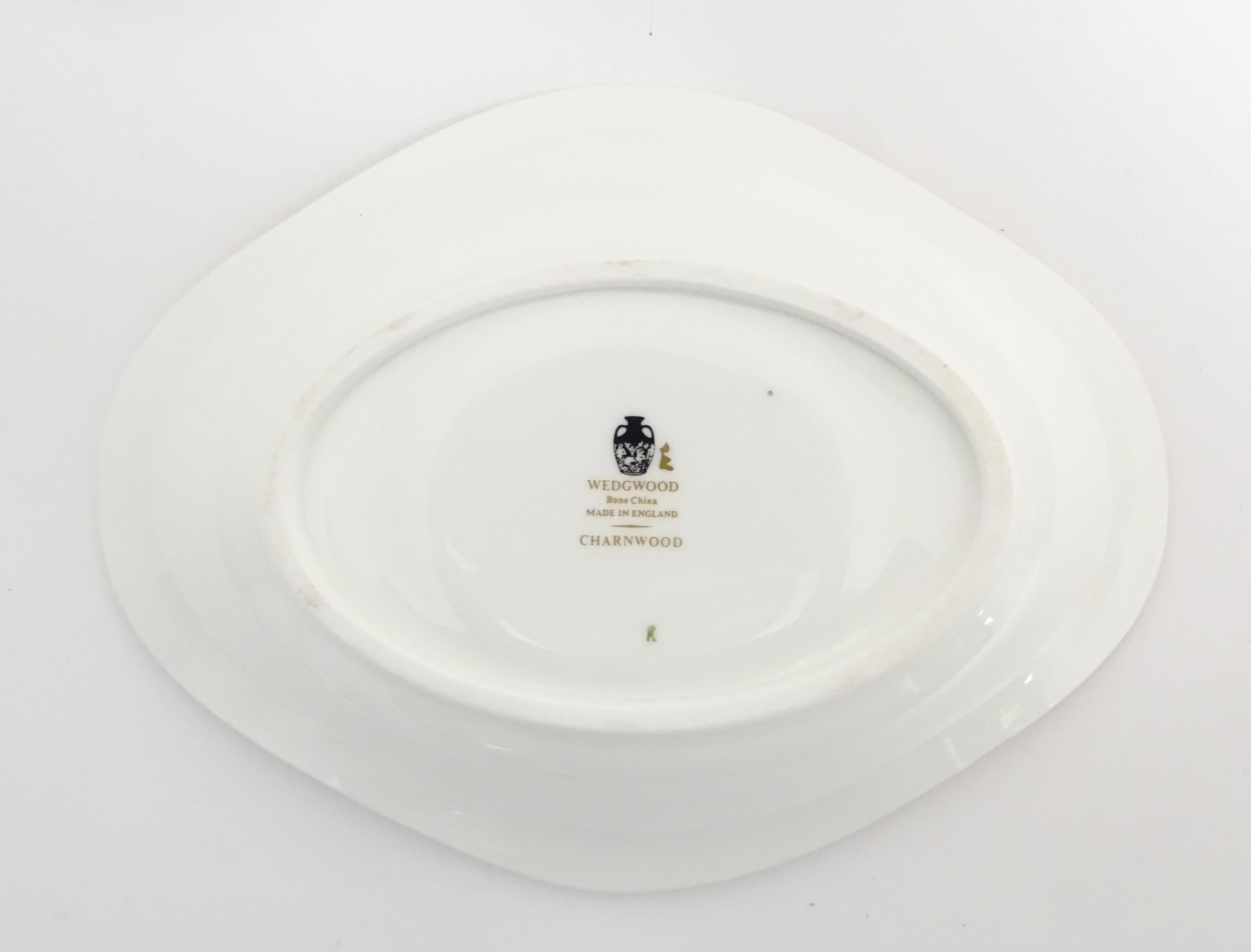 A quantity of Wedgwood dinner wares in the Charnwood pattern to include plates, twin handles soup - Image 25 of 25