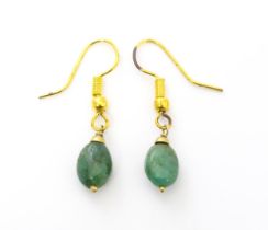 A pair of gilt metal earrings with green stone drops. Approx 1 1/4" long Please Note - we do not