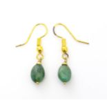 A pair of gilt metal earrings with green stone drops. Approx 1 1/4" long Please Note - we do not