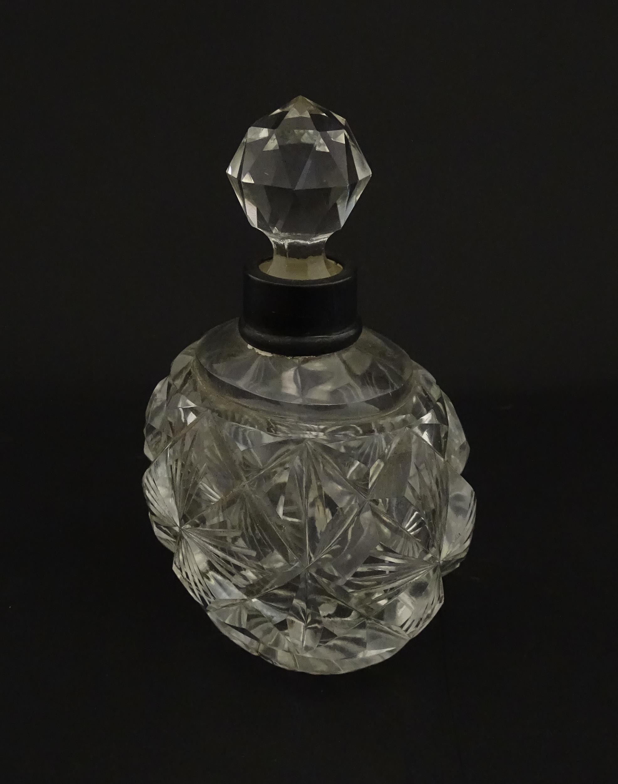 A cut glass scent / perfume bottle with silver top hallmarked London C.1933 . Approx. 5 1/4" high - Image 4 of 8