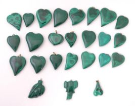 A quantity of malachite hardstone pendants formed as hearts etc. The largest approx 1 1/2" high